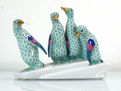 Lot 320 - A Herend figure modelled as four penguins on...