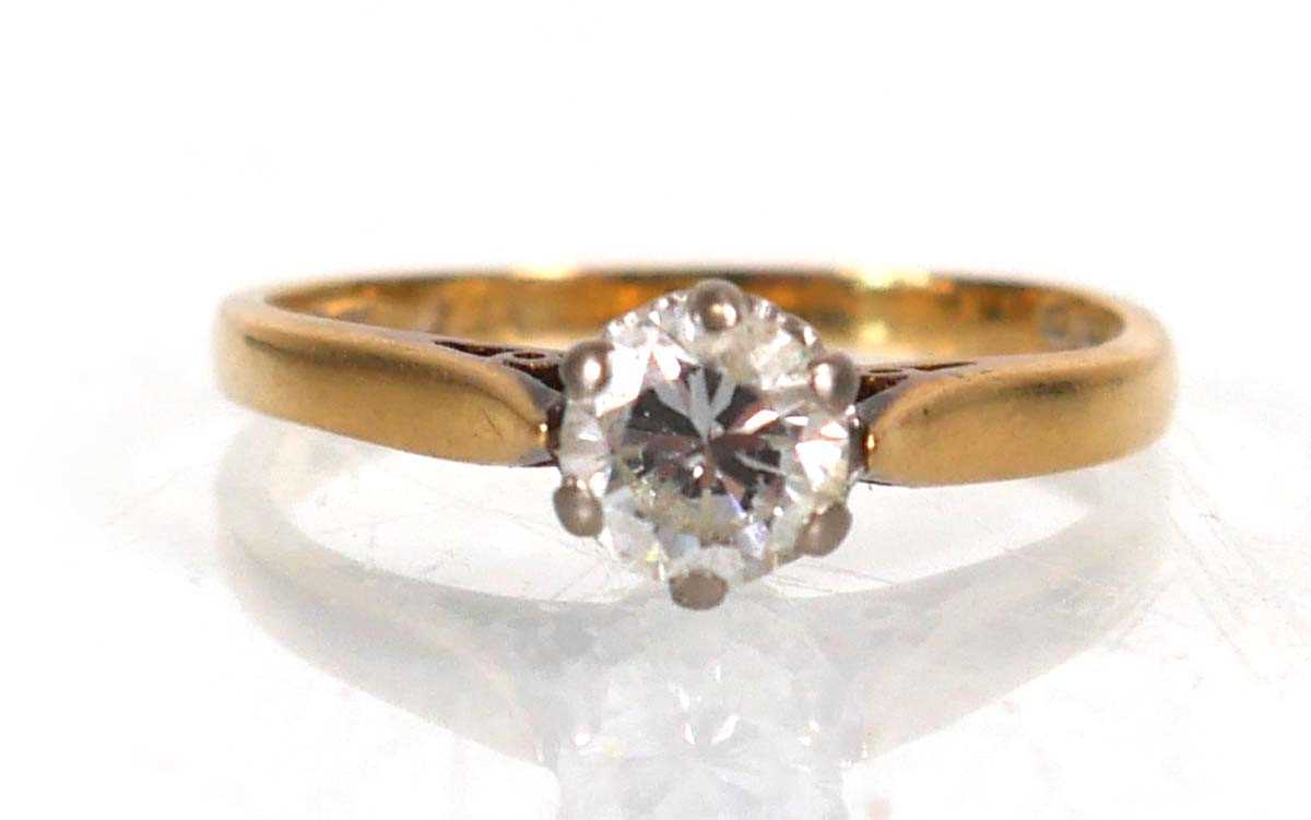 Lot 745 - An 18ct yellow gold ring set brilliant cut...