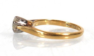 Lot 745 - An 18ct yellow gold ring set brilliant cut...