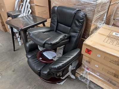 Lot 397 - Black leather effect easy chair with matching...