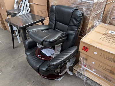 Lot 398 - Beige leather effect easy chair with matching...