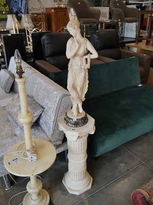 Lot 1019 - Classical female figurine mounted to a marble...