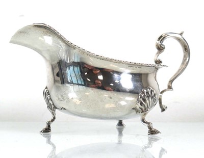 Lot 357 - An early 20th century silver sauce boat with...