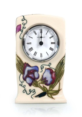 Lot 327 - A Moorcroft mantle timepiece of rectangular...