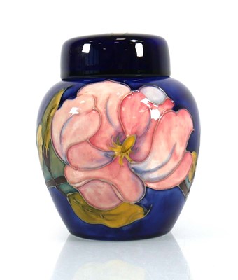 Lot 334 - A Moorcroft jar and cover decorated with pink...