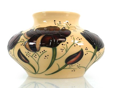 Lot 335 - A Moorcroft trial vase of squat form decorated...