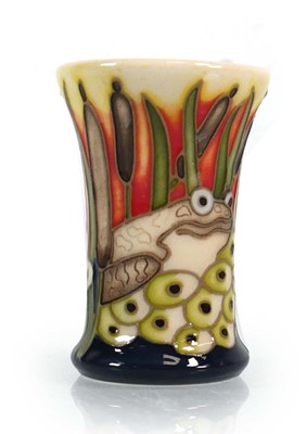 Lot 337 - A miniature Moorcroft vase decorated in the...