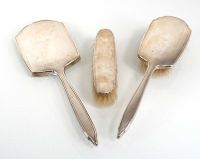 Lot 362 - A silver engine turned three piece dressing...