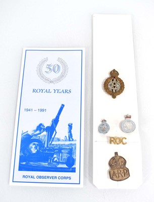 Lot 48 - A silver A.R.P. badge together with an...