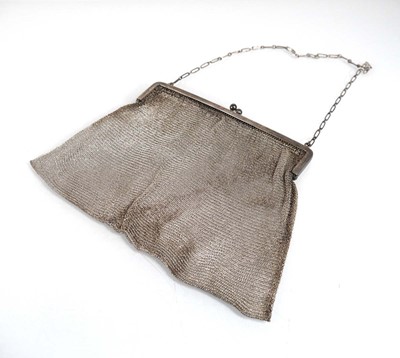 Lot 373 - A silver framed meshlink purse on an elongated...