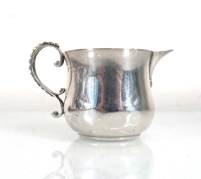 Lot 374 - A late Victorian silver cream jug with beaded...