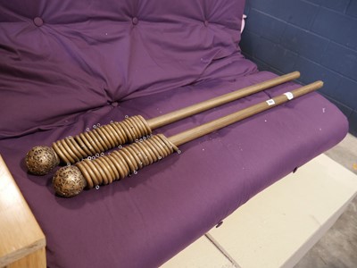 Lot 1069 - 2 wooden curtain poles, measuring 100"...
