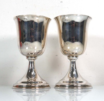 Lot 389 - A pair of Egyptian metalware goblets of...