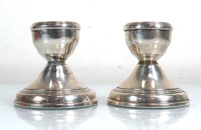 Lot 393 - A pair of silver dwarf candlesticks, maker...