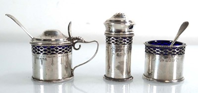 Lot 409 - An early 20th century silver three piece cruet...
