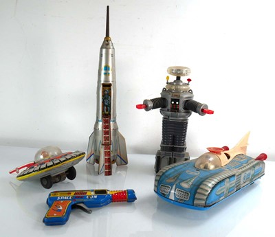 Lot 261 - A group of space related tinplate and plastic...