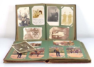 Lot 90 - Two albums of early 20th century postcards...