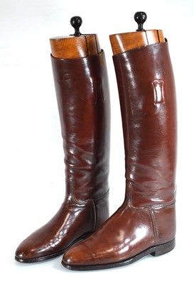 Lot 81 - A pair of brown leather riding boots with...