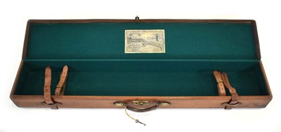 Lot 15 - A leather-covered fishing rod case with brass...