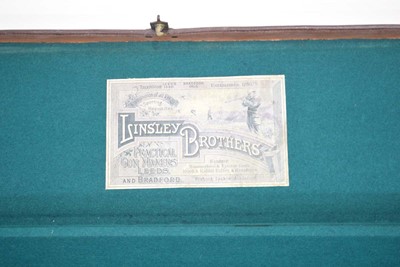 Lot 15 - A leather-covered fishing rod case with brass...