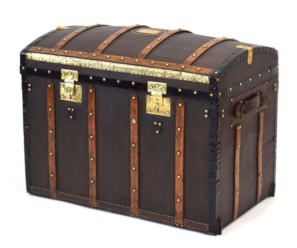 Lot 16 - A dome topped travelling trunk with beech...
