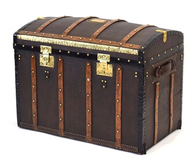 Lot 16 - A dome topped travelling trunk with beech...