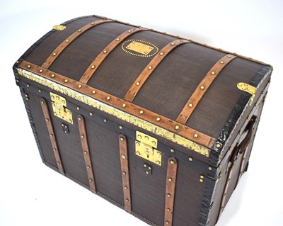Lot 16 - A dome topped travelling trunk with beech...