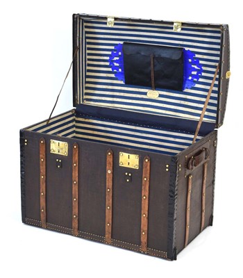 Lot 16 - A dome topped travelling trunk with beech...