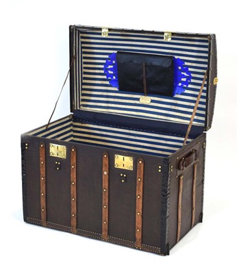 Lot 16 - A dome topped travelling trunk with beech...
