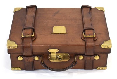 Lot 17 - A leather-covered cartridge case/magazine with...