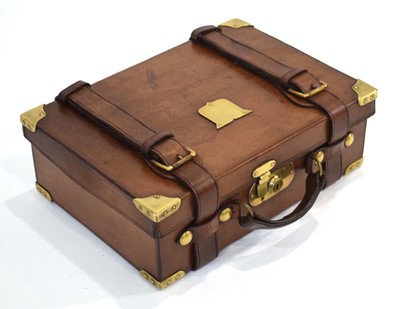Lot 17 - A leather-covered cartridge case/magazine with...