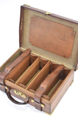 Lot 17 - A leather-covered cartridge case/magazine with...