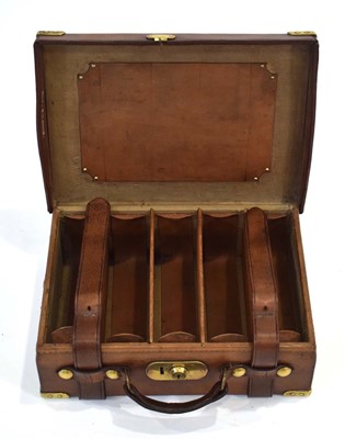 Lot 17 - A leather-covered cartridge case/magazine with...