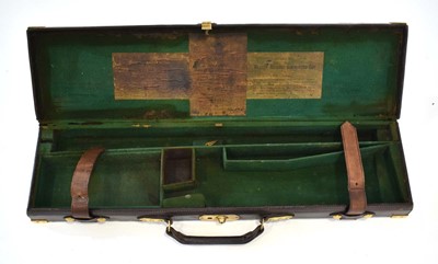 Lot 18 - A leather-covered and brass mounted gun case,...