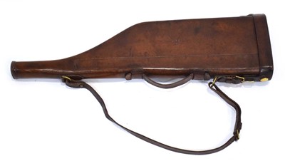 Lot 19 - A leather 'shoulder of mutton' gun case with...