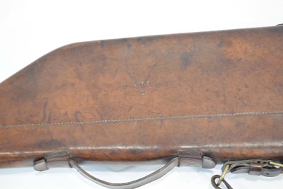 Lot 19 - A leather 'shoulder of mutton' gun case with...