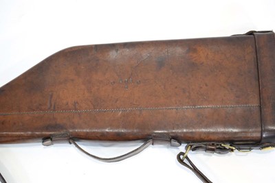Lot 19 - A leather 'shoulder of mutton' gun case with...