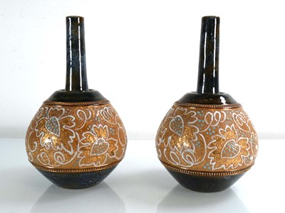 Lot 279 - A pair of Royal Doulton bottle vases, each...