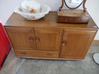 Lot 1016 - Mid century Ercol sideboard unit on castors...