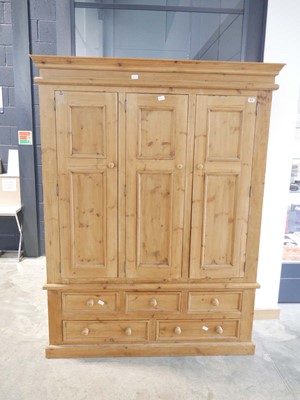 Lot 1026 - Pine triple fronted wardrobe with an...