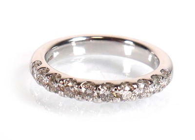 Lot 743 - An 18ct white gold half eternity ring set ten...