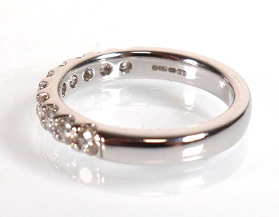 Lot 743 - An 18ct white gold half eternity ring set ten...