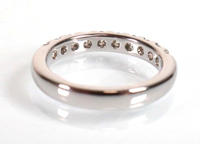 Lot 743 - An 18ct white gold half eternity ring set ten...