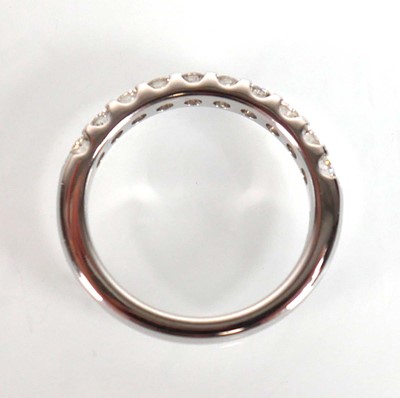Lot 743 - An 18ct white gold half eternity ring set ten...