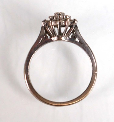 Lot 734 - An 18ct white gold cluster ring set small...