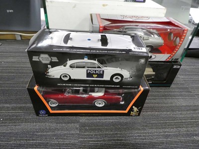 Lot 2187 - Four boxed diecast vehicles- a model icons...