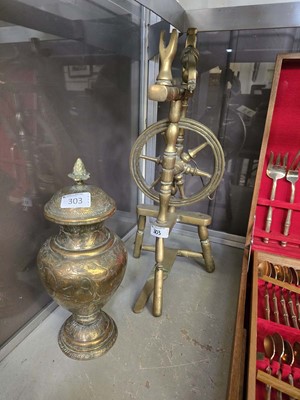 Lot 303 - An eastern style embossed brass urn along with...