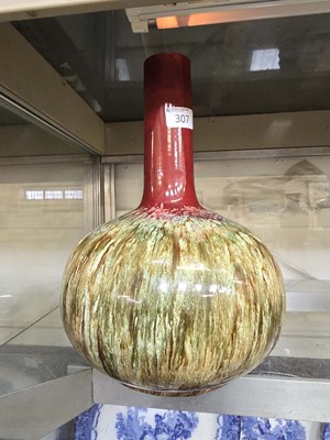 Lot 307 - A mid 20th century red ground ceramic vase