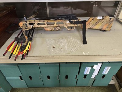Lot 313 - A camouflage crossbow, along with a small...