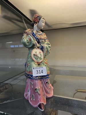 Lot 314 - An oriental ceramic figurine of a lady (a/f)...